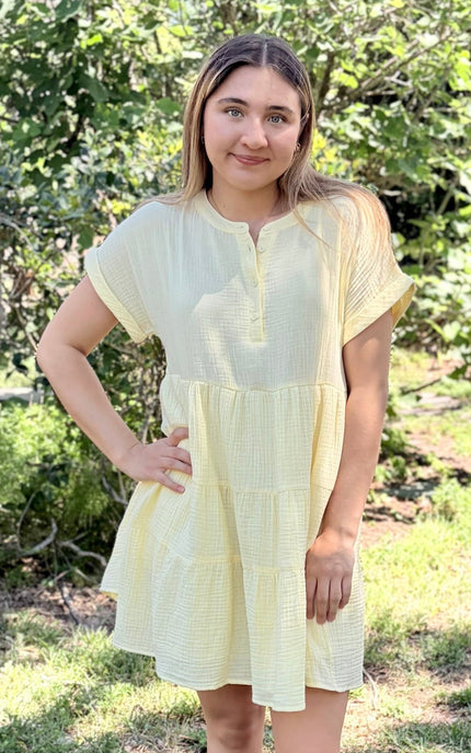 Breathable double gauze mini dress in outdoor setting, showing practical everyday styling