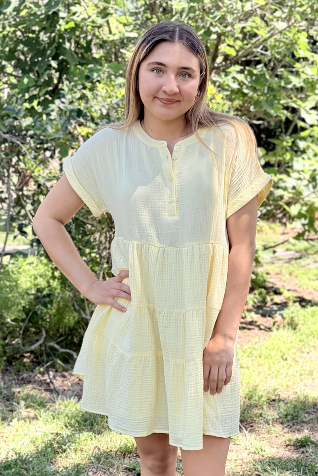 Breathable double gauze mini dress in outdoor setting, showing practical everyday styling