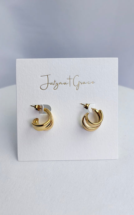 Double twist hoop earrings in 18k gold PVD over 316L stainless steel with sculpted dimensional design