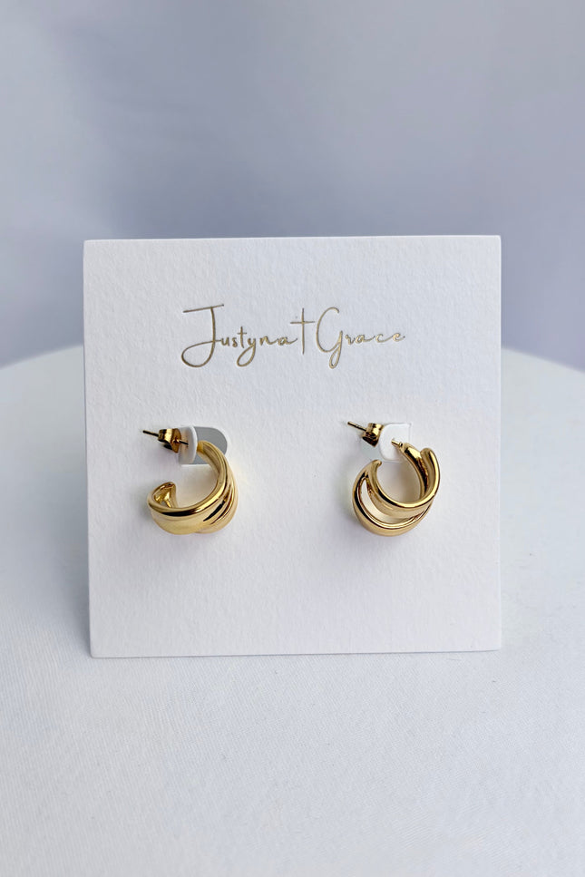 Double twist hoop earrings in 18k gold PVD over 316L stainless steel with sculpted dimensional design