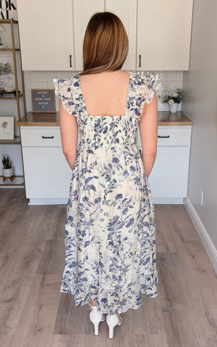 Model wearing Eden Tencel blend floral midi dress with sweetheart neckline