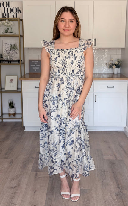 Model wearing Eden Tencel blend floral midi dress with sweetheart neckline