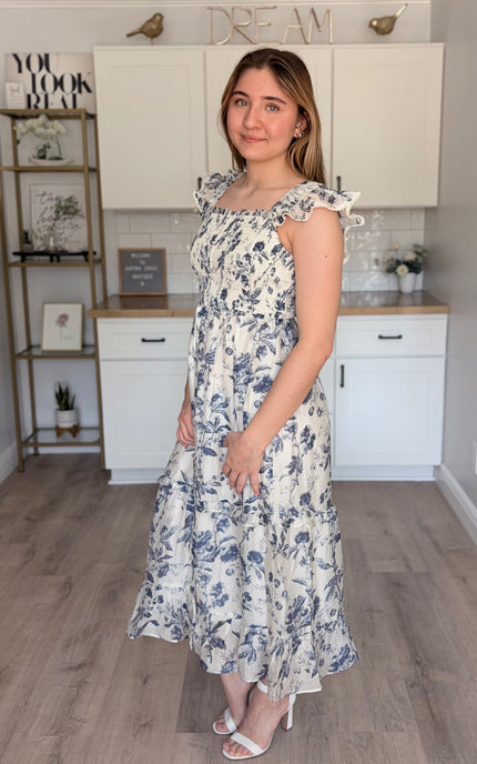 Model wearing Eden Tencel blend floral midi dress with sweetheart neckline
