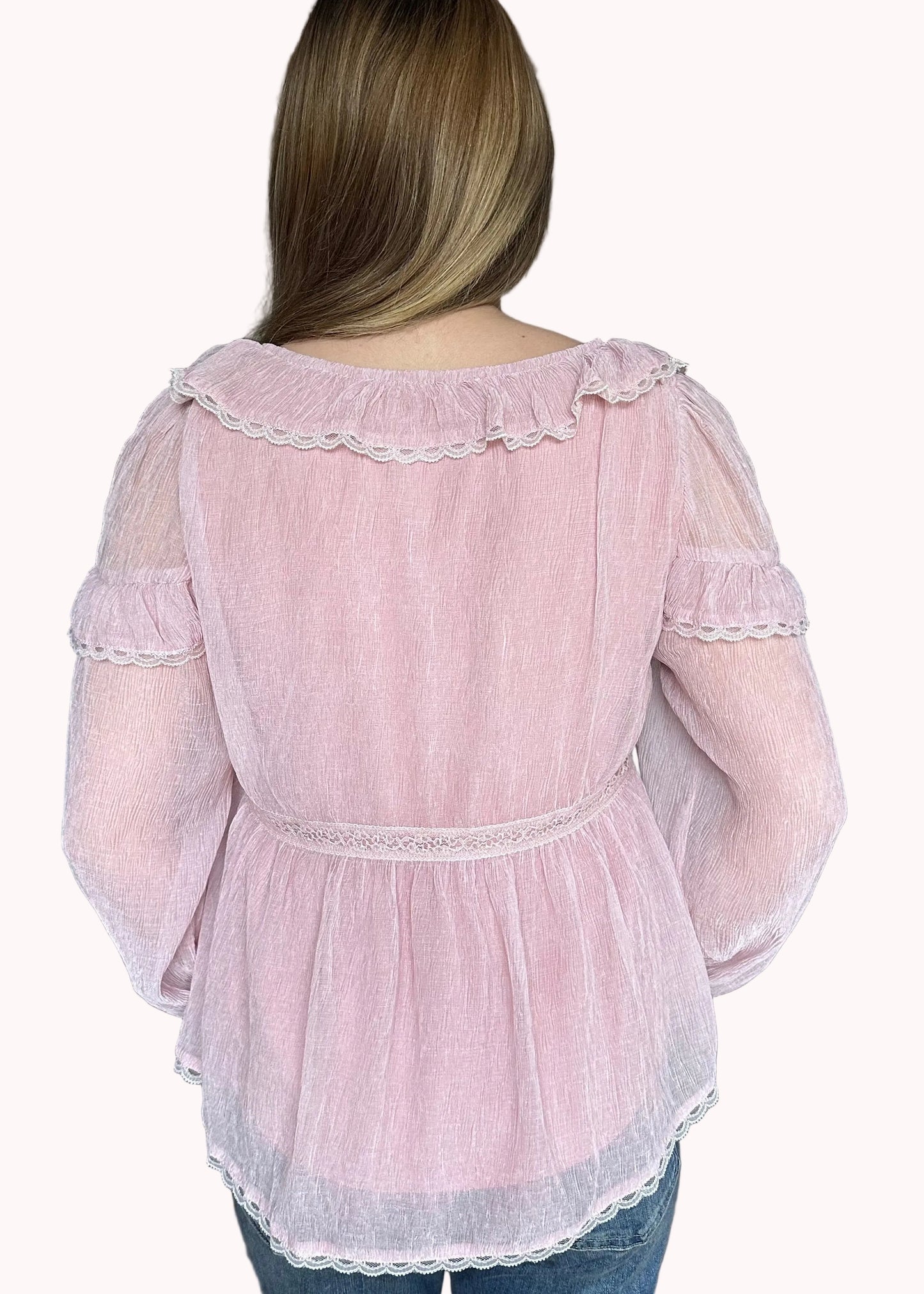Back view of the Eleanor peasant blouse with relaxed fit and lightweight chiffon fabric