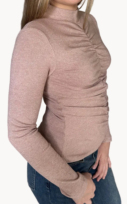 Side view of the Elena mock neck top showing allover ruching and flattering fitted shape