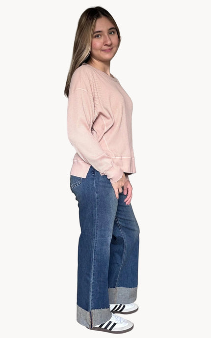 Side view of the Eliza knit top highlighting subtle drop shoulders and side slit detail