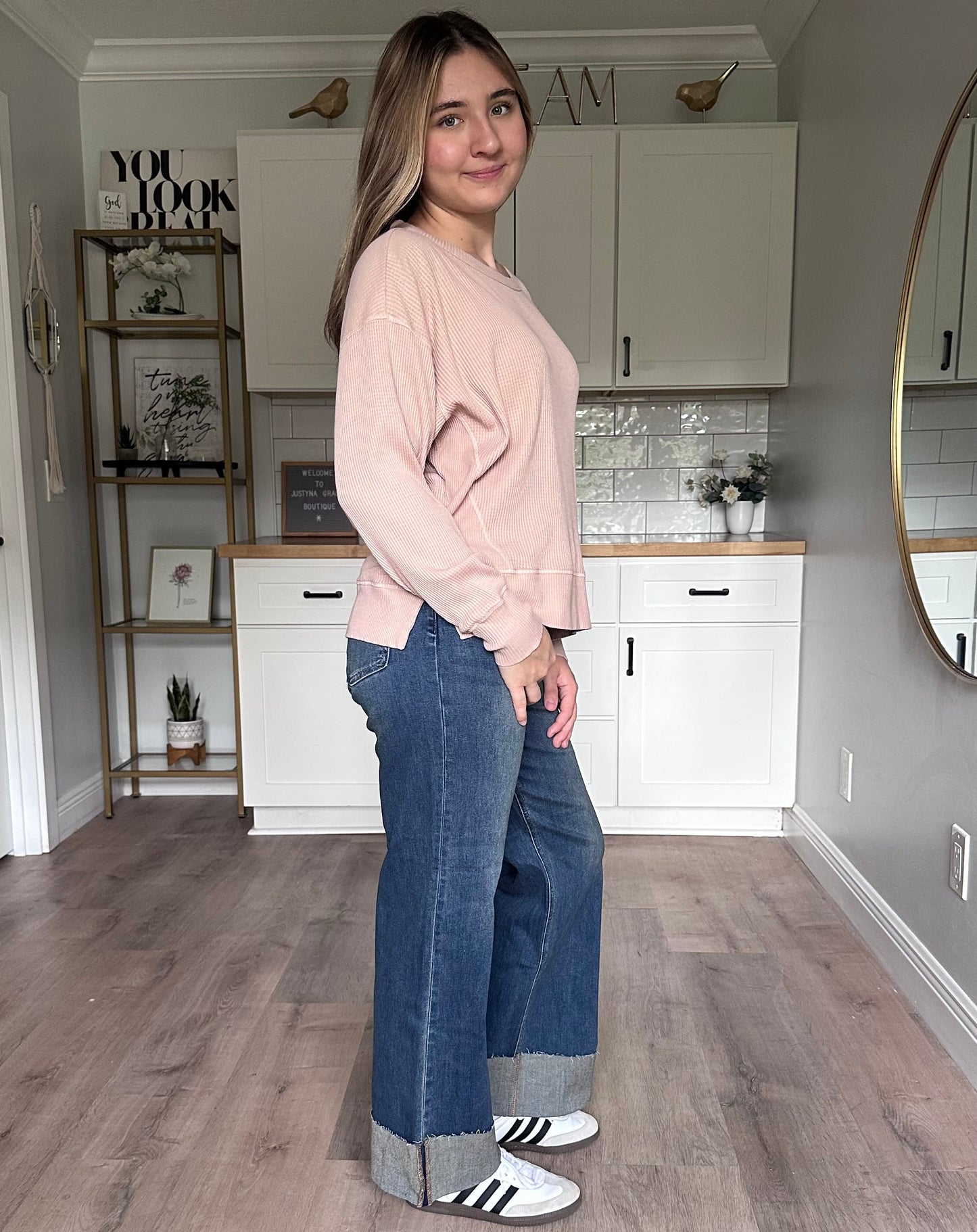 Side view of the Eliza knit top highlighting subtle drop shoulders and side slit detail