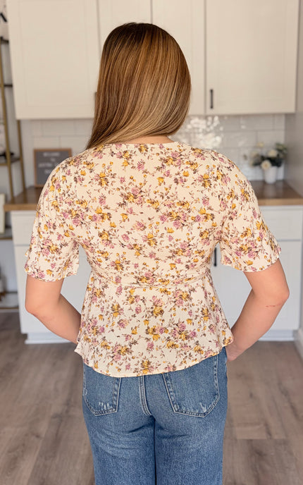 Emilia floral wrap blouse back view with soft floral print and wrap bodice