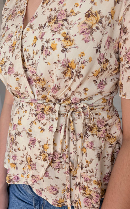 Emilia floral wrap blouse front detail view with soft floral print and wrap bodice
