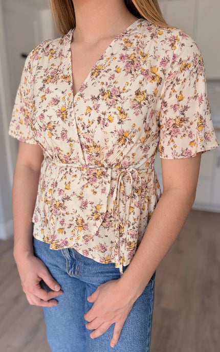 Emilia floral wrap blouse front detail view with soft floral print and wrap bodice
