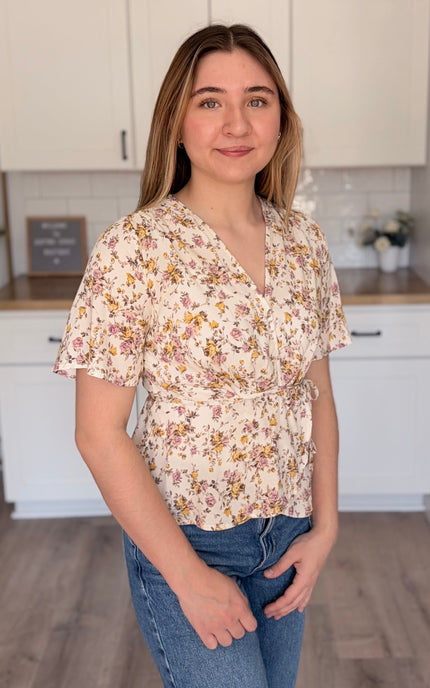 Emilia floral wrap blouse side view with soft floral print and wrap bodice