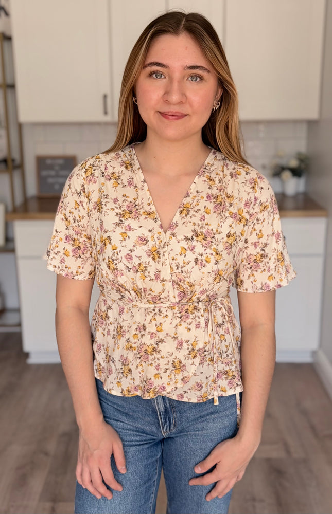 Emilia floral wrap blouse front view with soft floral print and wrap bodice