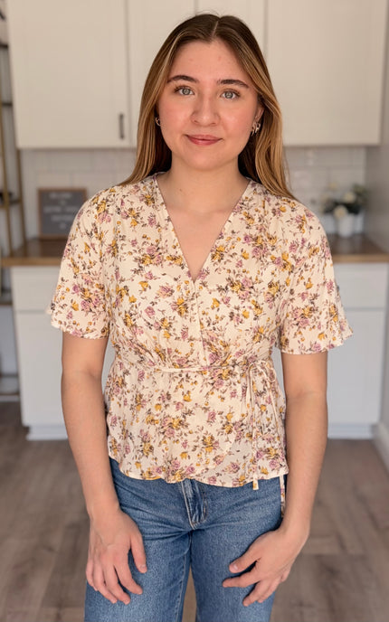 Emilia floral wrap blouse front view with soft floral print and wrap bodice