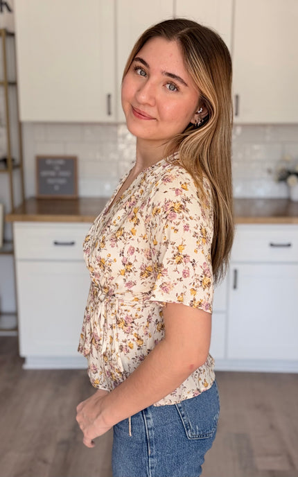Emilia floral wrap blouse side view with soft floral print and wrap bodice