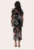 Evening Poise Dress — elegant floral print midi with sleek silhouette and back slit from Justyna Grace Boutique.