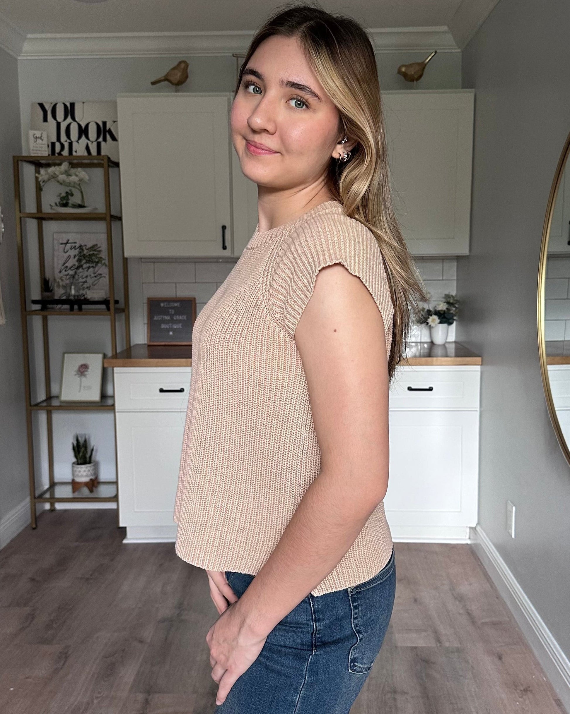 Side view of the everyday sweater tee highlighting short sweater sleeves and breathable cotton knit