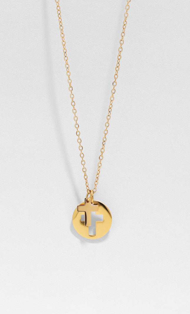 Detailed close-up of minimal cross cutout on round pendant of Faith Cross Pendant Necklace, highlighting the precision of the design