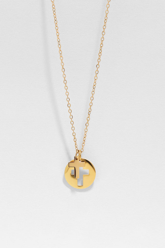 Detailed close-up of minimal cross cutout on round pendant of Faith Cross Pendant Necklace, highlighting the precision of the design
