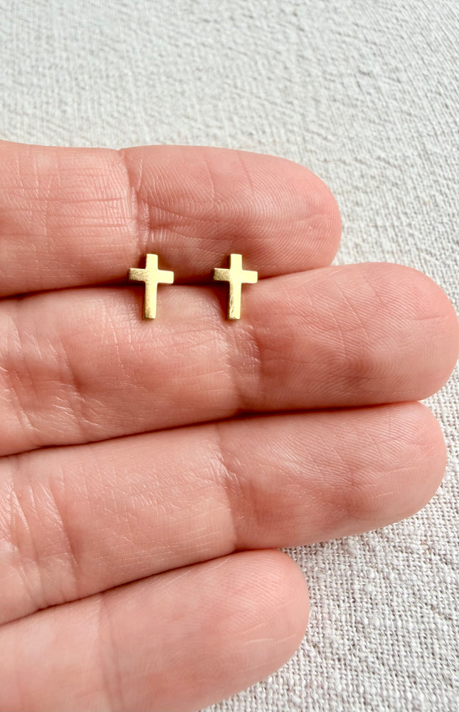 Close-up of Faith Cross Stud Earring front showing minimal cross design in 18k gold PVD over stainless steel