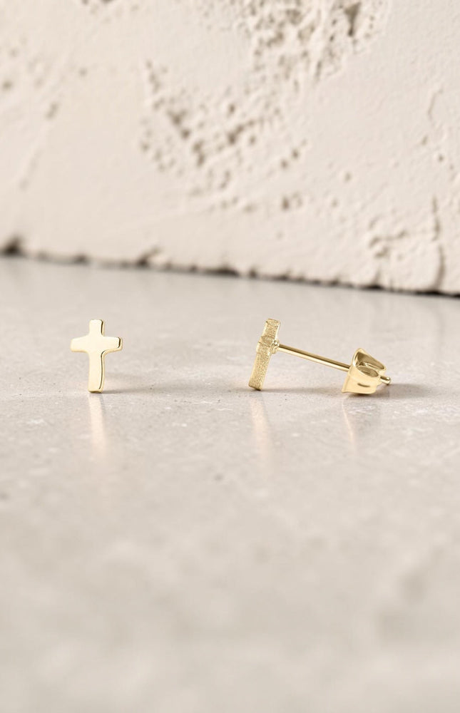Faith Cross Stud Earring showing minimal cross design and hypoallergenic post backing in 18k gold PVD plating