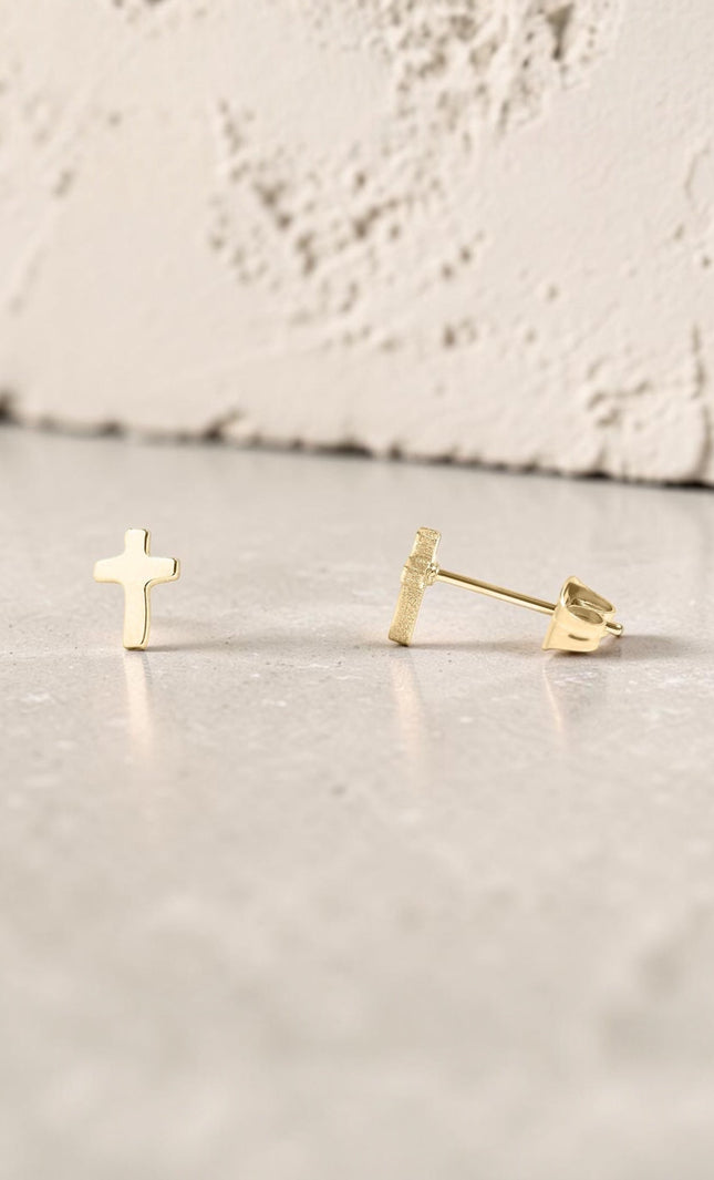 Faith Cross Stud Earring showing minimal cross design and hypoallergenic post backing in 18k gold PVD plating