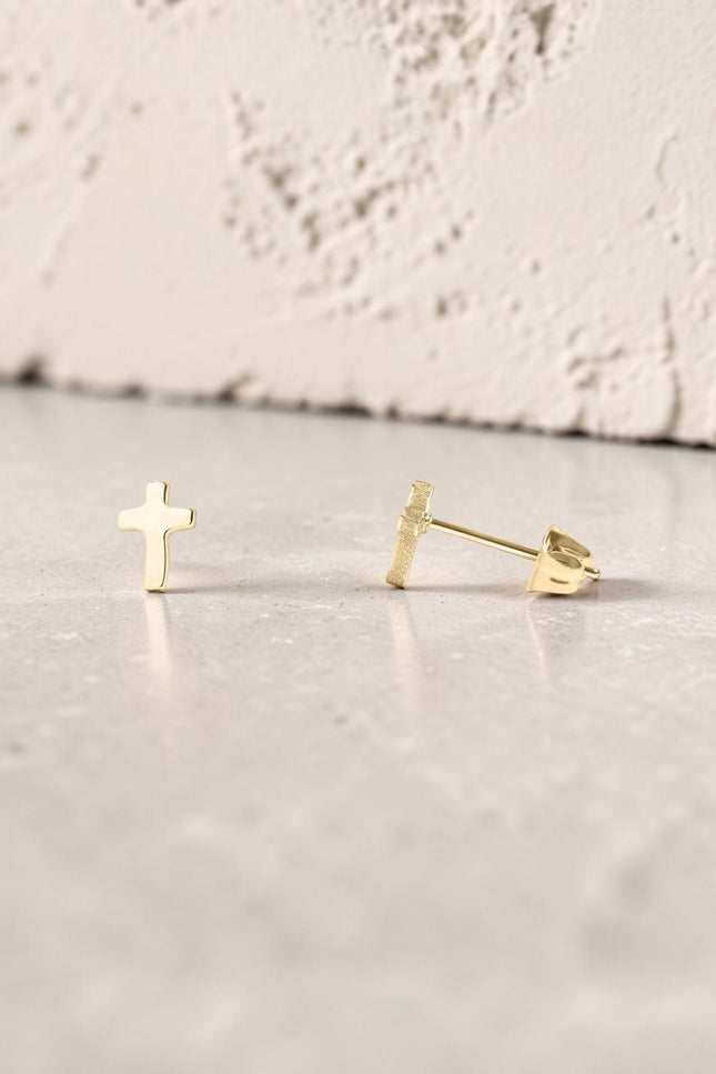 Faith Cross Stud Earring showing minimal cross design and hypoallergenic post backing in 18k gold PVD plating