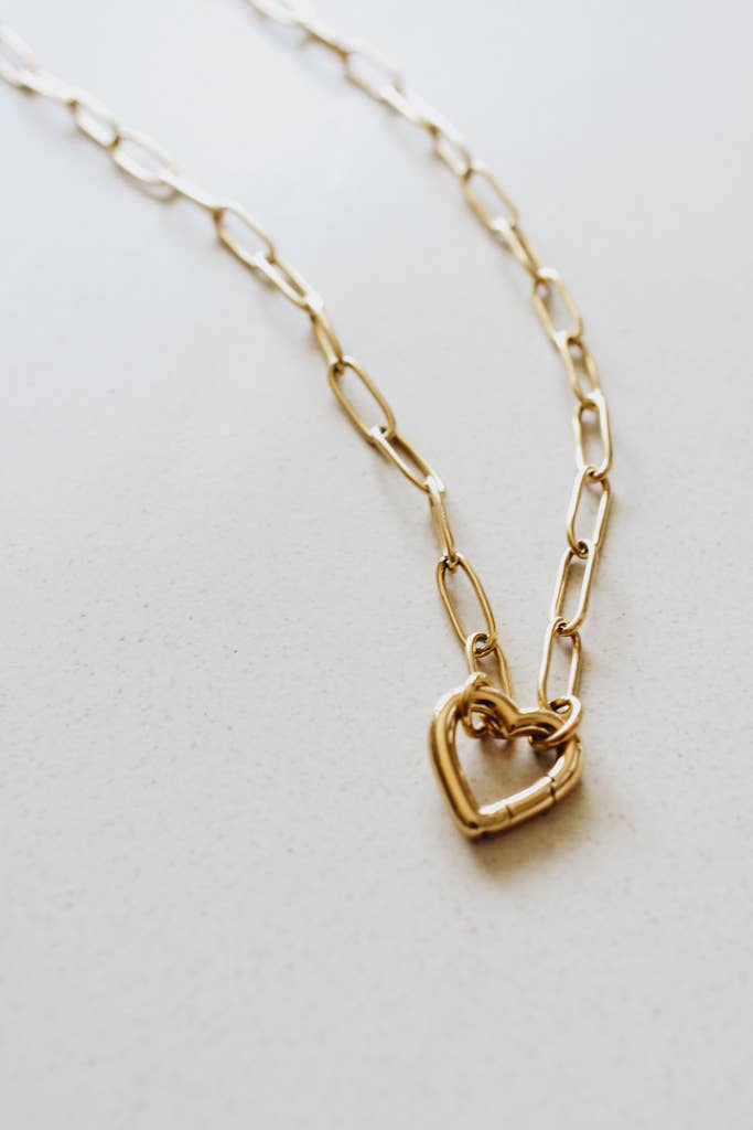 Faithful Heart Pendant — 18K gold-plated waterproof necklace with openable heart charm ethically made by survivors from Justyna Grace Boutique. 