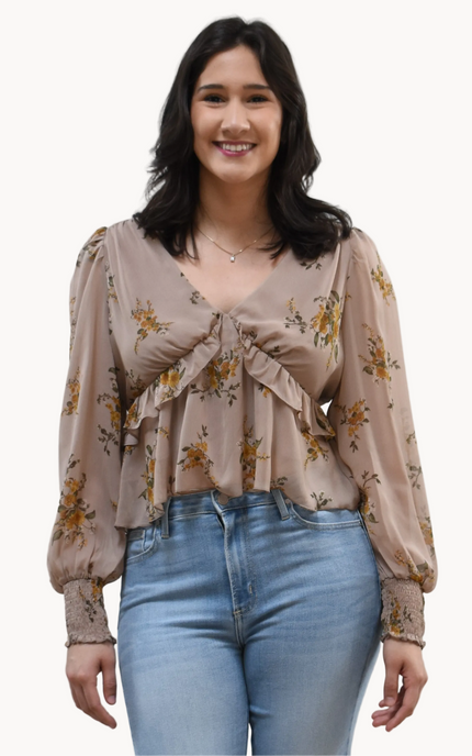 Floral Drift Blouse on soft linen background, featuring a delicate floral print and lightweight chiffon fabric.
