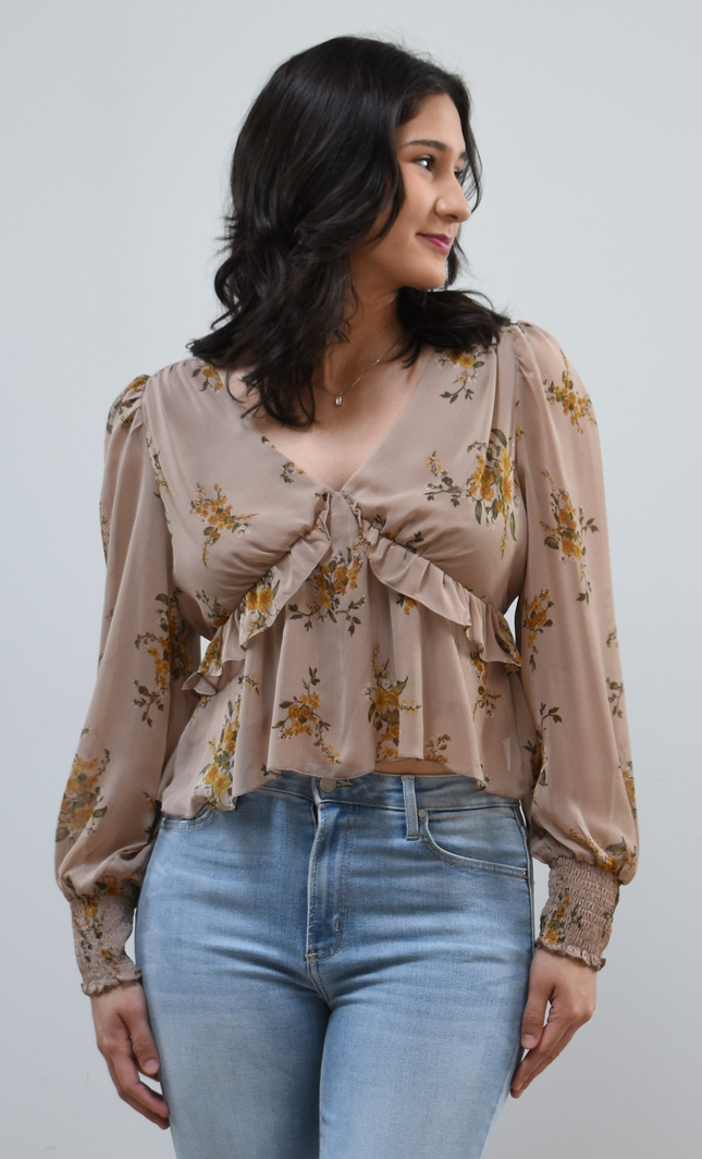 Floral Drift Blouse on soft linen background, featuring a delicate floral print and lightweight chiffon fabric.