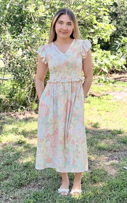 Woman's hand in side pocket of cotton dress, showing functional pocket detail