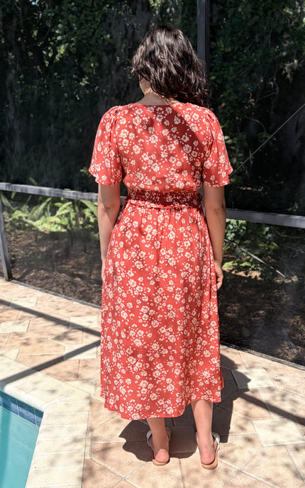 Back view of floral midi dress with soft drape