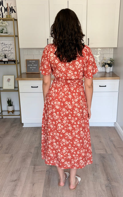 Back view of floral midi dress with soft drape