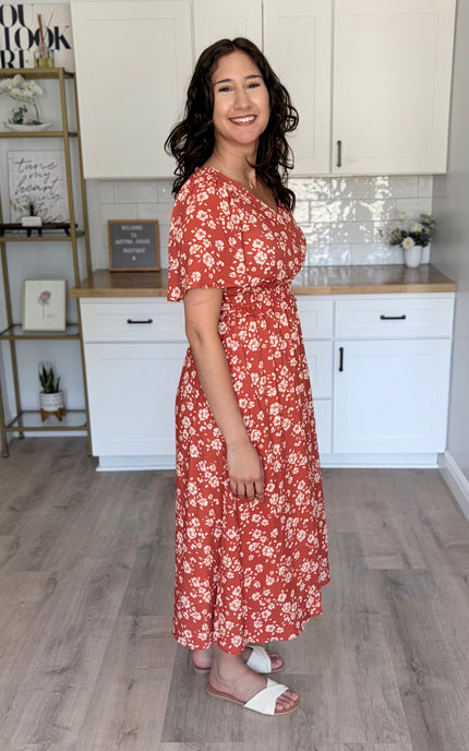 Side view of floral midi dress with defined waist