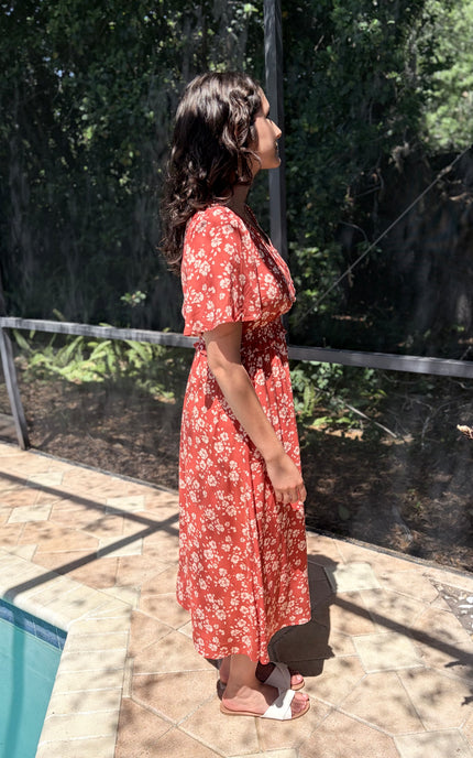 Side view of floral midi dress with defined waist