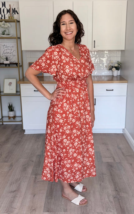 Side view of floral midi dress with defined waist