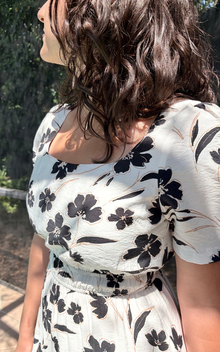 Close-up of square neckline on floral midi dress