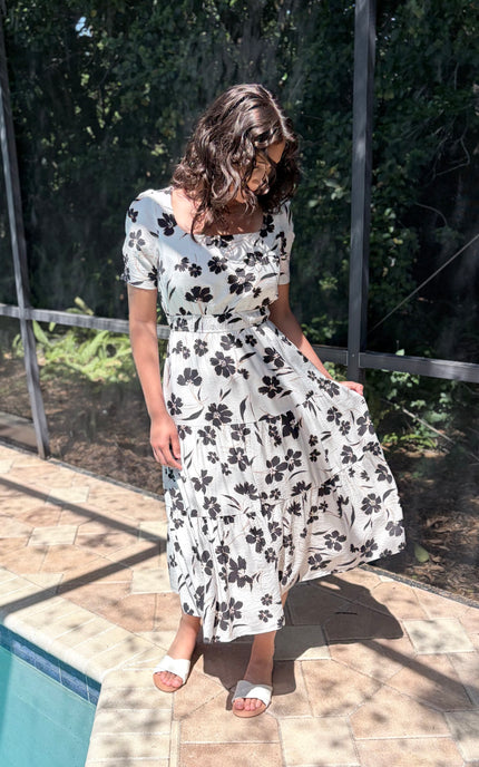 Feminine floral midi dress with square neckline and tiered skirt front view
