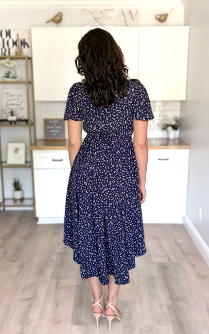 Back view of floral midi dress with soft drape