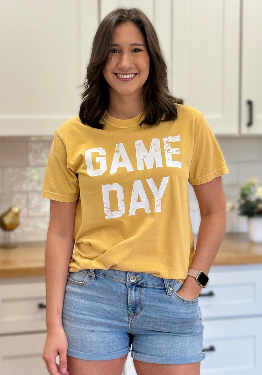 Vintage-style “Game Day Sports” graphic tee in soft garment-dyed cotton with relaxed unisex fit.