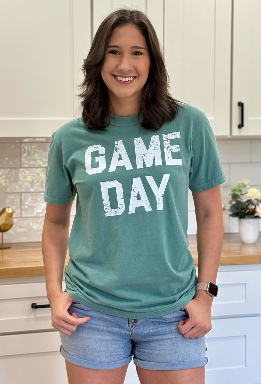 Vintage-style “Game Day Sports” graphic tee in soft garment-dyed cotton with relaxed unisex fit.