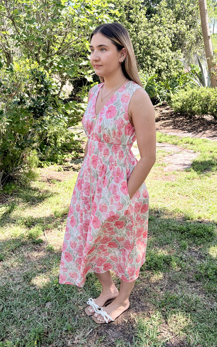 Left side profile of Garden Floral Cotton Midi Dress in watercolor floral, showing V-neckline, sleeveless bodice, and side pocket detail