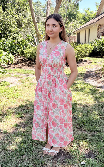 Woman in Garden Floral Cotton Midi Dress styled casually with simple sandals for a relaxed afternoon, showcasing comfortable smocked waist and breathable cotton fabric