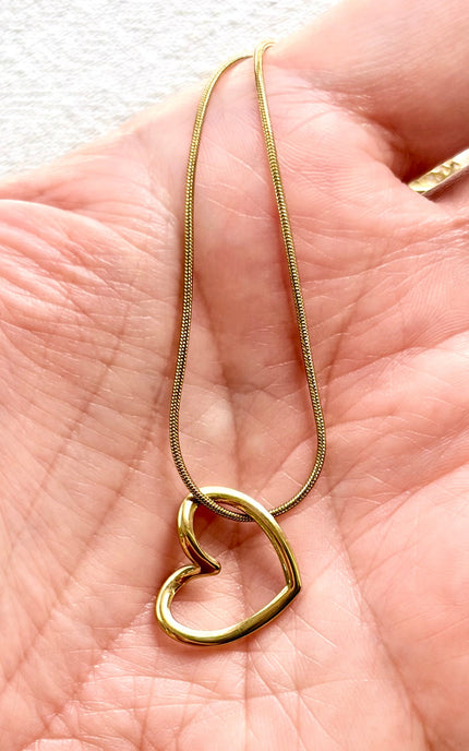 minimal gold heart pendant necklace flat lay, feminine everyday jewelry