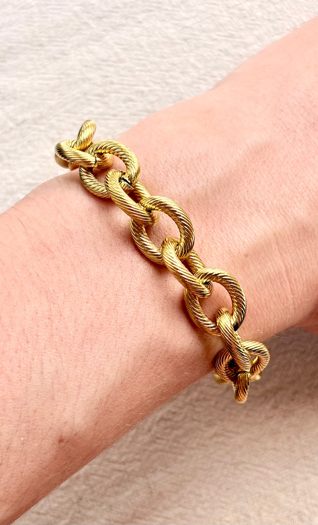 gold cable link bracelet on soft linen background in natural light, chunky everyday jewelry
