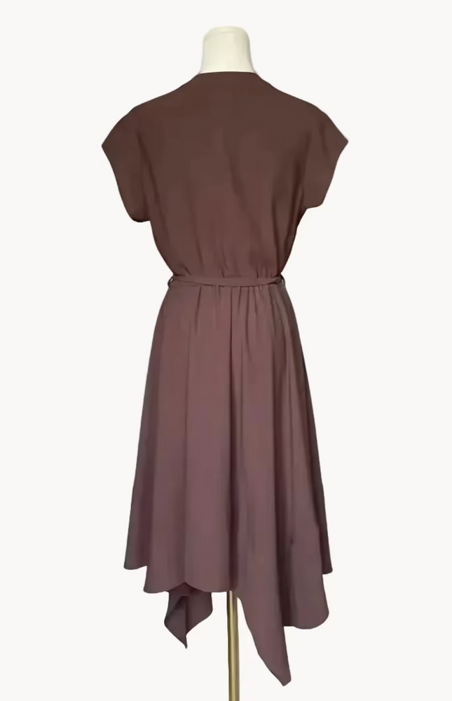 Brown dress on a mannequin against a white background