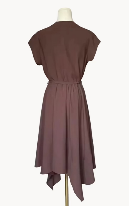 Brown dress on a mannequin against a white background