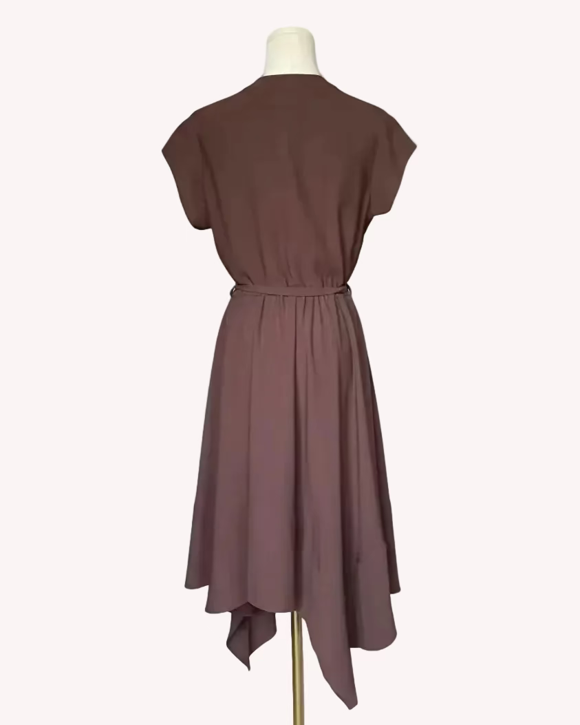 Brown dress on a mannequin against a white background