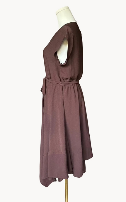 Brown dress on a mannequin against a white background
