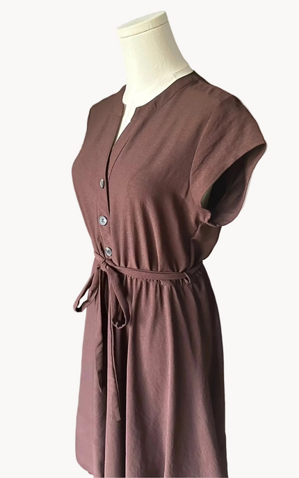 Brown dress on a mannequin against a white background