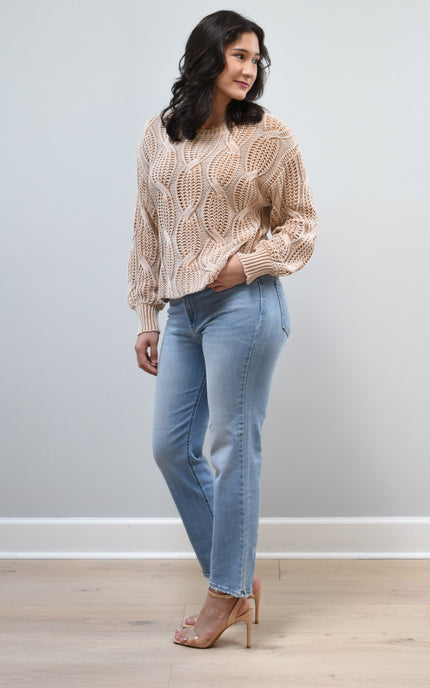 Heritage Cotton Cable Sweater on soft linen background, featuring 100% cotton knit with cable and ribbed texture.